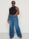 Calça Feminina Plus Size Wide Leg Jeans Tachas Laterais